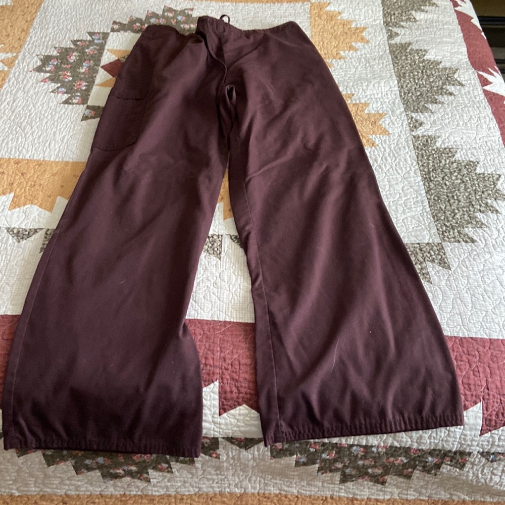 Drawstring front elastic back additional pocket on right leg. smoke free home